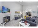 Cozy living room showcasing a fireplace, comfortable seating, and seamless flow to the kitchen at 9772 Leyland Dr. # 9772-9, Myrtle Beach, SC 29572