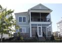 Two-story home featuring screened porch and back porch with a fenced yard at 981 Crystal Waterway Dr., Myrtle Beach, SC 29579