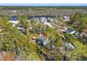 Beautiful aerial view of a serene home nestled among trees, situated near the river in a charming neighborhood at 5800 Creekside Dr., Myrtle Beach, SC 29588