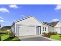 Attractive single-story home with a two-car garage, an ample driveway and manicured landscaping at 3034 Deerberry Place, Longs, SC 29568