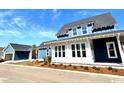 This beautiful home features white trim, complementary siding colors, and an attached garage at 1583 Sayebrook Pkwy., Myrtle Beach, SC 29588