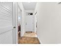Hallway view with closet, front door, carpet and tile flooring at 1137 Peace Pipe Ln. # 201, Myrtle Beach, SC 29579