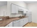 Bright kitchen featuring white appliances, cabinets, and countertops at 1137 Peace Pipe Ln. # 201, Myrtle Beach, SC 29579
