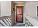 A welcoming front door with glass pane, stylish hardware, and a charming welcome mat awaits you at 3015 Old Bryan Dr. # 13-1, Myrtle Beach, SC 29577