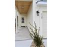 Front entrance with white columns, a covered walkway and landscaping at 110 Hallandale Lane # Left, Murrells Inlet, SC 29576