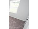 Neutral bedroom featuring a window and plush gray carpet at 358 Jeff Waters Circle, Longs, SC 29568