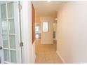 Bright hallway with tiled flooring, leading to an open living space with lots of natural light at 340 Walden Lake Rd., Conway, SC 29526