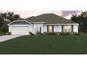 Beautiful home with an attached two-car garage, shutters, and lush green lawn at 190 Joanna Gillard Ln., Georgetown, SC 29440