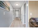 Bright condo hallway featuring tiled floor and neutral walls at 5905 South Kings Hwy. # A450, Myrtle Beach, SC 29575