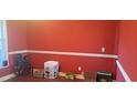 Dining room with red walls, crown molding, and hardwood floors at 78 Joys Pl., Andrews, SC 29510