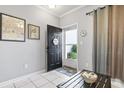 Inviting entryway with black door and small table at 1525 Lanterns Rest Rd. # 103, Myrtle Beach, SC 29579