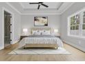 Calming main bedroom with a tray ceiling, a large window and neutral décor at 289 Waterfall Circle, Little River, SC 29566