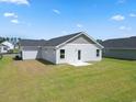 This home features a spacious backyard with a concrete porch perfect for entertaining at 1061 Kinness Dr., Conway, SC 29527