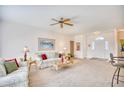Inviting living room with plush seating, neutral walls and carpet, and a view of the foyer at 812 Lalton Dr., Conway, SC 29526