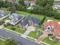 An aerial view shows the home with a manicured lawn and mature trees in a desirable neighborhood at 9048 Abingdon Dr., Myrtle Beach, SC 29579