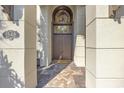Elegant entrance with a wooden door, brick walkway, and stone pillars at 1549 Serena Dr., Myrtle Beach, SC 29579