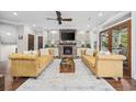 Spacious living room with hardwood floors, a fireplace, and French doors leading to a balcony at 130 Hagar Brown Rd., Murrells Inlet, SC 29576