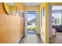 Bright foyer with colorful walls and wood-look floors at 149 Harmony Ln., Myrtle Beach, SC 29588