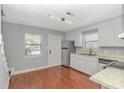 Charming kitchen with stainless steel appliances, breakfast bar, and wood floors at 5173 Inlet Garden Ct. # 7A, Murrells Inlet, SC 29576