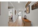 Bright hallway with light wood floors and access to other rooms at 665 Woodland Farms Circle, Aynor, SC 29511