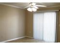 Neutral bedroom with ceiling fan and sliding glass door with vertical blinds at 3762 Citation Way # 1016, Myrtle Beach, SC 29577