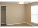 Neutral bedroom with a window, closet, ceiling fan, and tile flooring at 3762 Citation Way # 1016, Myrtle Beach, SC 29577