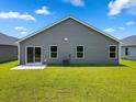 Green backyard with lawn and patio, perfect for outdoor enjoyment and entertaining at 1126 Cherrystone Loop, Conway, SC 29526