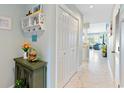 Condo hallway with tile floors and coat closet at 4633 Lightkeepers Way # 5-J, Little River, SC 29566