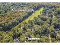 Aerial view of 89 Gleneagle Ln. nestled in lush trees, near the Heritage Plantation Golf Course at 89 Gleneagle Ln., Pawleys Island, SC 29585
