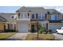 Charming yellow two-story home with beautiful landscaping and a private balcony at 206 Mossy Stone Ct. # 1605, Murrells Inlet, SC 29576