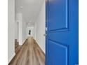 Bright entryway with luxury vinyl plank flooring leading to the living spaces of the house at 389 Sun Colony Blvd., Longs, SC 29568