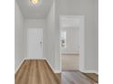 Bright entryway with luxury vinyl plank flooring leading to carpeted rooms and white trim at 389 Sun Colony Blvd., Longs, SC 29568
