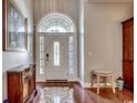Inviting foyer with hardwood floors, an arched window over the front door, and elegant decor at 8556 Juxa Dr., Myrtle Beach, SC 29579