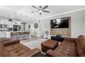 Living room with leather couches and kitchen view at 935 Desert Wheatgrass Dr., Myrtle Beach, SC 29579