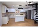 Modern kitchen featuring stainless steel appliances, granite countertops, and a kitchen island at 37 Geney Ln., Pawleys Island, SC 29585