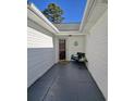 Inviting front entry with a cozy seating area and neutral accents at 2169 Wedgewood Dr., Longs, SC 29568