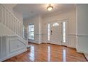 Elegant foyer with hardwood floors, a staircase, and a door with decorative glass at 121 Grand Palm Ct., Myrtle Beach, SC 29579