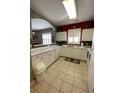 White kitchen with appliances and tile floor at 5801 Oyster Catcher Dr. # 124, North Myrtle Beach, SC 29582