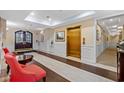 Elegant lobby area with wood-look floors, comfortable seating, elevator, and double door entrance at 2241 Waterview Dr. # 437, North Myrtle Beach, SC 29582