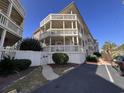 Multi-story condo featuring spacious balconies and access walkway at 2805 N Ocean Blvd. # 107, Myrtle Beach, SC 29577