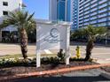 The Chelsea House Villas sign with vibrant landscaping and street view at 2805 N Ocean Blvd. # 107, Myrtle Beach, SC 29577