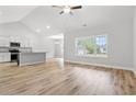 Bright and airy living area with modern finishes, wood floors, and a vaulted ceiling at 608 Britt St., Georgetown, SC 29440