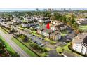 Aerial view of a condo complex near a beach and road with mature landscaping, ponds, and a pool at 3735 Block House Way # 113, Myrtle Beach, SC 29577
