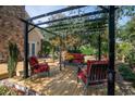 Cozy outdoor living space with a pergola, comfortable seating, and a tranquil atmosphere at 1716 Club Circle Dr., Pawleys Island, SC 29585