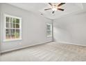 Bright bedroom with neutral walls, plush carpeting, and ample natural light at 387 Lifestyle Court, Surfside Beach, SC 29575