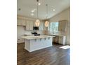 Modern kitchen featuring an island with white marble countertops and stainless-steel appliances at 8663 Farrier Dr., Myrtle Beach, SC 29588
