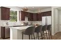 Modern kitchen with stainless steel appliances, dark wood cabinets, white countertops, and island with barstool seating at 4009 Braid Ct., Myrtle Beach, SC 29588