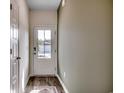 Inviting entryway with wood flooring, a white front door with glass, and neutral wall colors at 4009 Braid Ct., Myrtle Beach, SC 29588