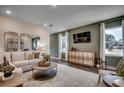 Comfortable living room featuring stylish decor, lots of natural light, and a cozy seating arrangement at 4009 Braid Ct., Myrtle Beach, SC 29588