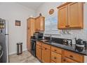 Wood cabinets, granite countertops, and a microwave at 1672 Langley Dr., Longs, SC 29568